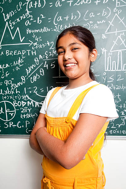 istock Cheerful Indian Girl Student with Mathematics Problems 182701901