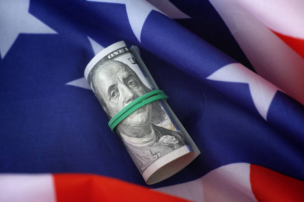 istock A one hundred dollar bill lying on an American flag 1827019165