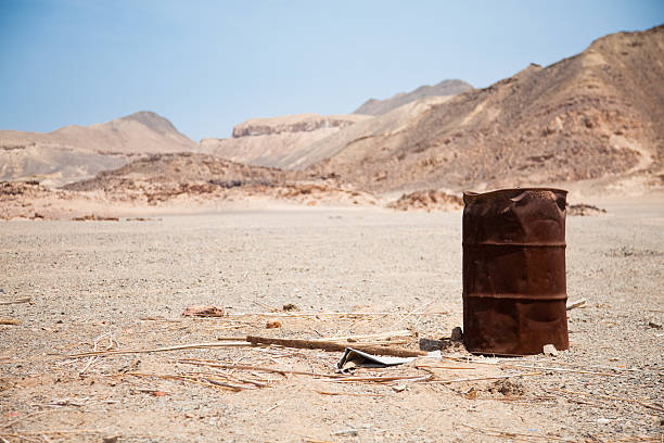 istock Desert track with oil barrel 182702268