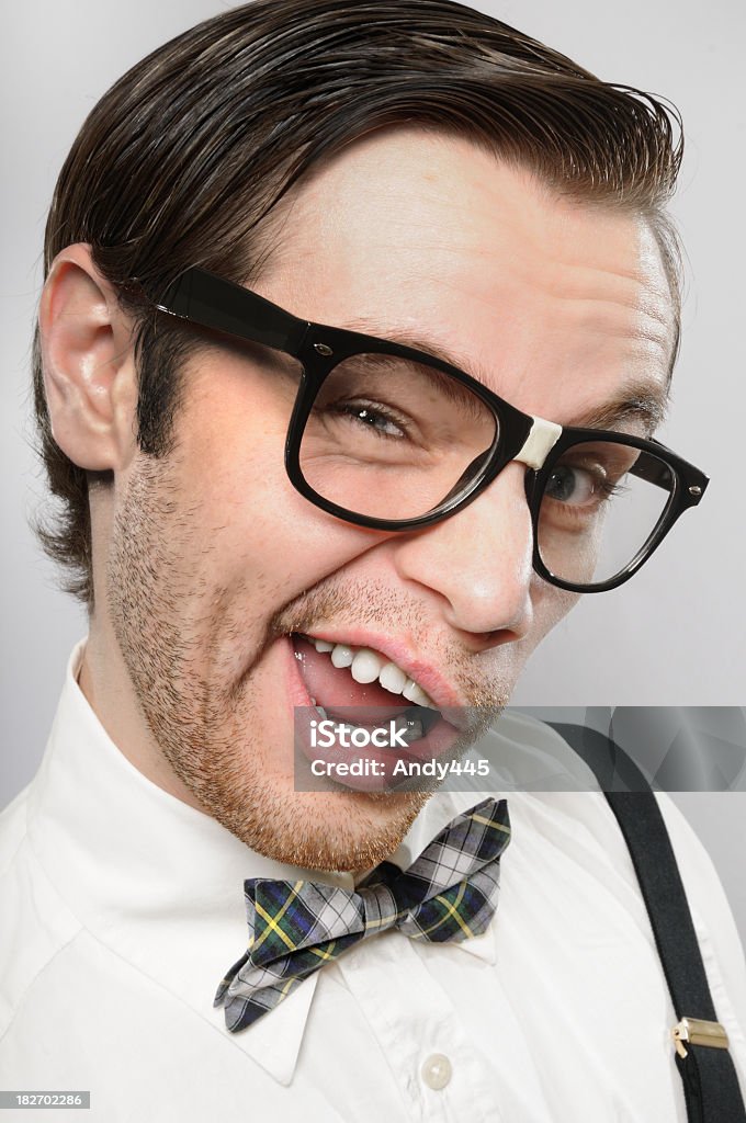 Nerd Nerd is trying to flirt looking in the camera.   Bow Tie Stock Photo