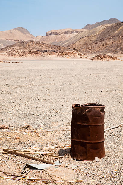 istock Desert track with oil barrel 182702765