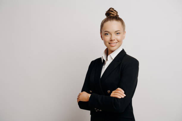 Professional secretary with a friendly demeanor, dressed in a black suit, exuding competence
