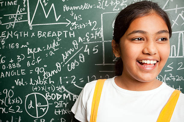 istock Cheerful Indian Girl Student with Mathematics Problems 182703443