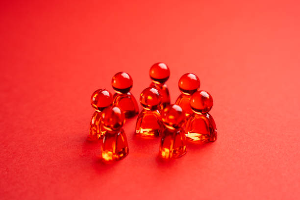 istock Red glass people figurines. Abstraction. Community or team. 1827036278