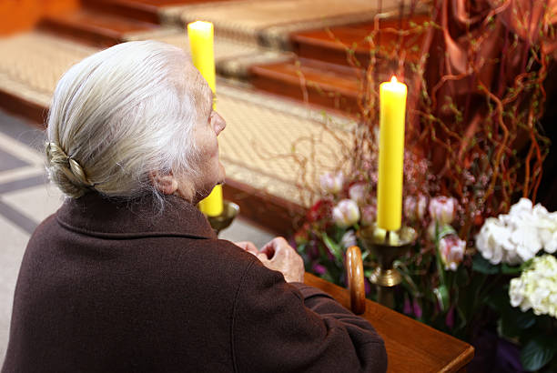 istock Woman in church 182703641