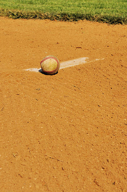 istock Pitcher's Mound Rubber, Dirt and Baseball in Field at Spring 182703880