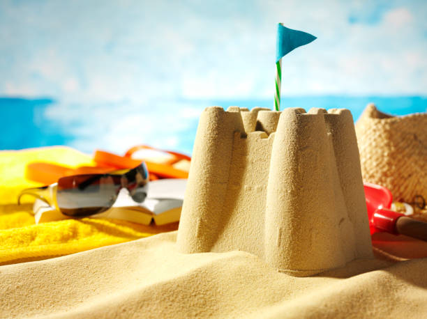 Sandcastle on the sand of a beach for child playing sand on the beach on summer holidays.