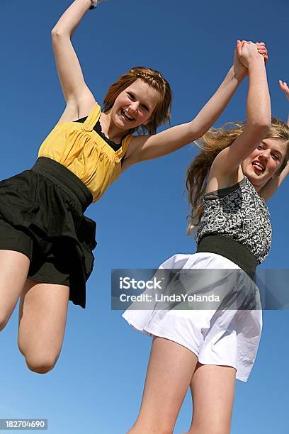 Happy Girls Jumping For Joy Stock Photo - Download Image Now - 12-13 Years, 14-15 Years, Activity