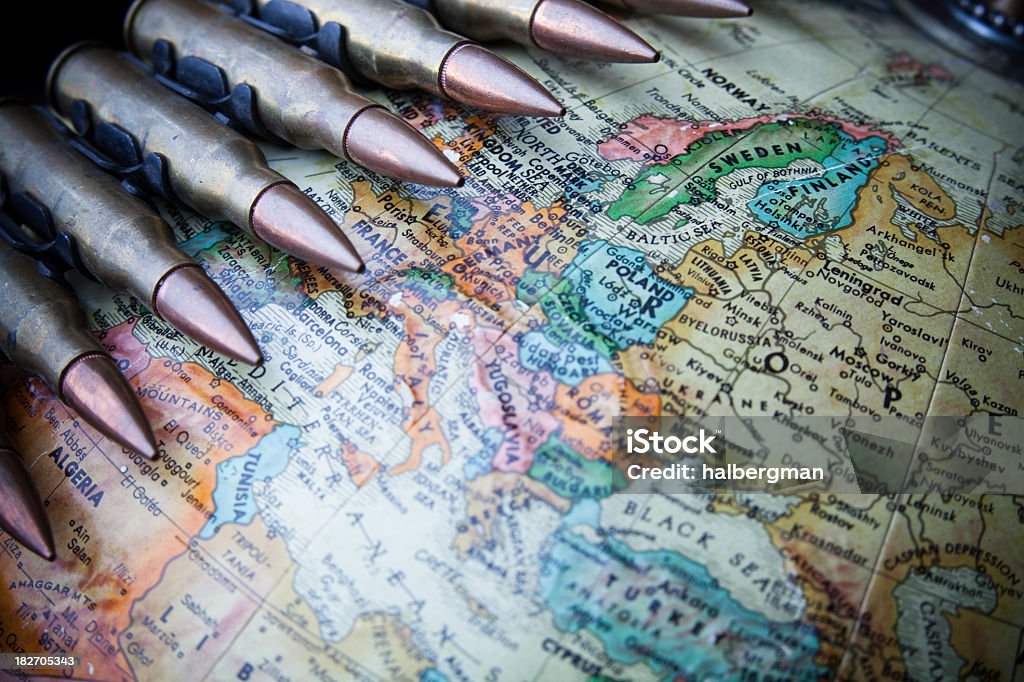 Europe at War Globe with Europe in focus and a bandolier of machine gun ammo draped across it. Bullet Stock Photo