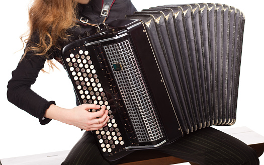 blue accordion, played by a man, in the frame only his hands