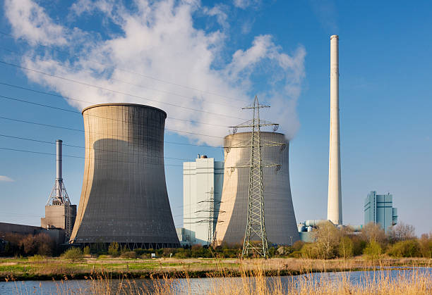 istock Power Plant With Steaming Cooling Towers 182706273