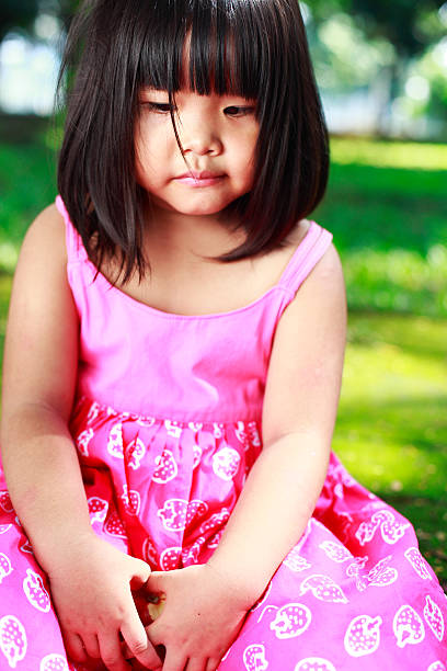 istock sad little girl 182706857