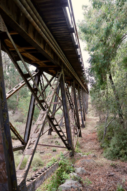 istock Steel beam train trestle forms a bridge across the canyon 1827069618