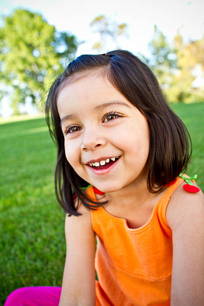 istock adorable hispanic girl smiling 182707103