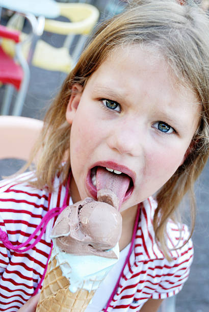 istock young girl eating ice cream 182707197