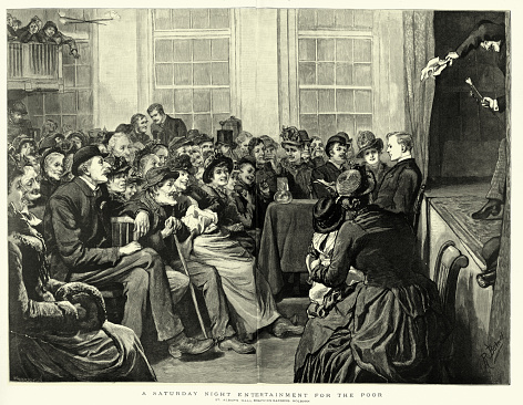 Vintage illustration of Victorian magician performing on stage, Saturday night entertainment for the poor, History, 1880s, 19th Century.  St Alban's Hall, Baldwin's Gardens Holborn, London