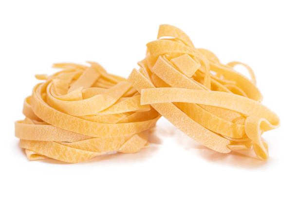 istock Two Classic Italian Raw Egg Fettuccine - Isolated on White Background 1827081185