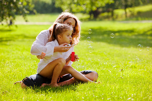 istock Mother and daughter having fun in park 182708128