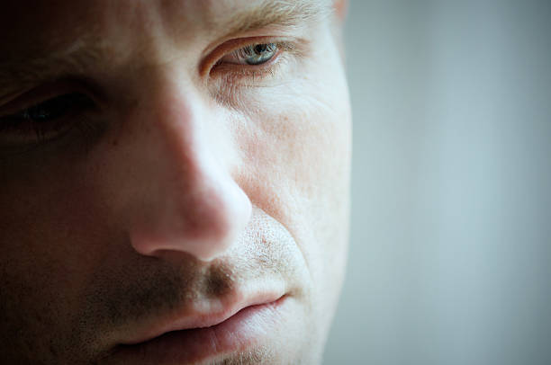 istock Close Up of Face Depressed Man Looking Down 182708264