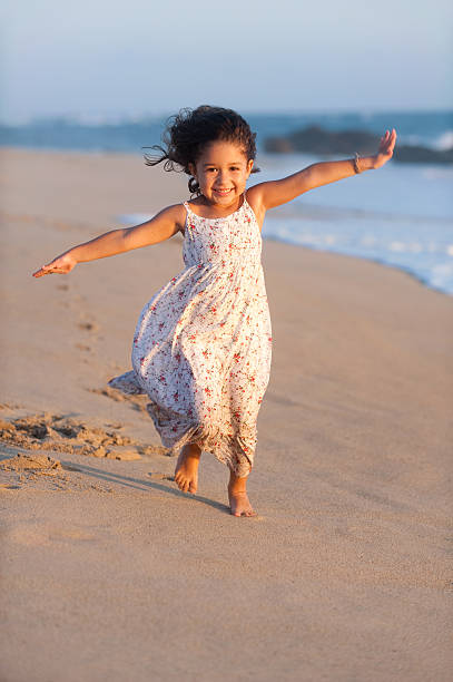 istock Cheerful little girl at the beach 182708637