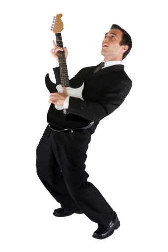 Businessman rocking out with an electric guitarhttp://www.twodozendesign.info/i/1.png
