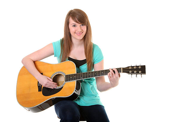 istock girl with acustic guitar 182708691