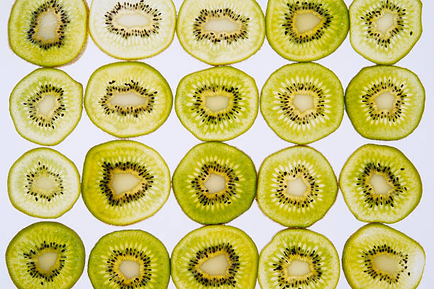 istock Isolated shot of Kiwi fruit cross section on white background 182709398