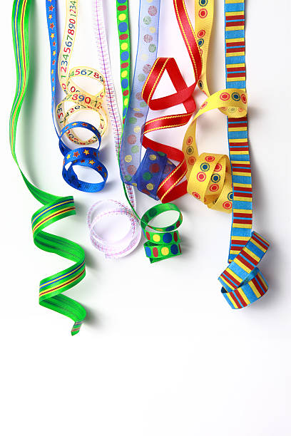 istock Row of multi-colored cloth ribbon, curled 182709618