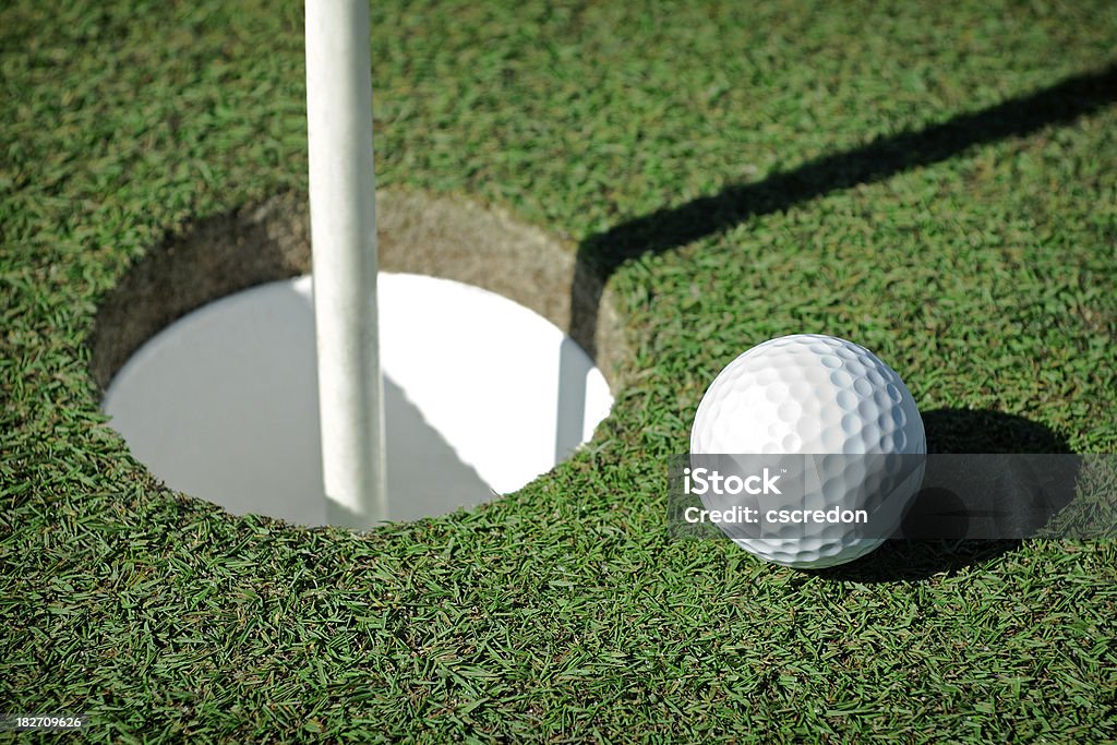 golf ball on green Approaching Stock Photo