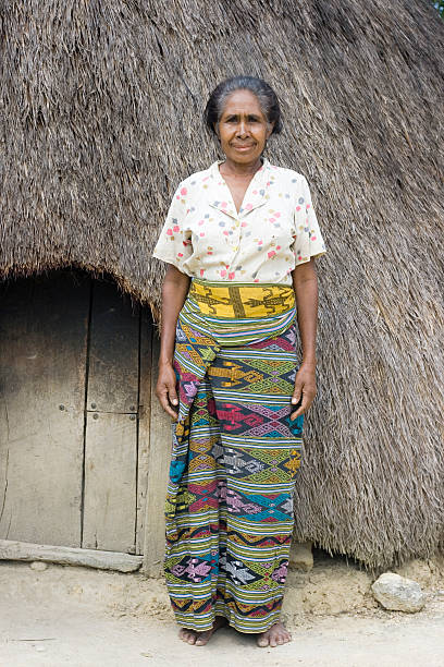 istock Traditonal woman using colorful sarong. 182710334