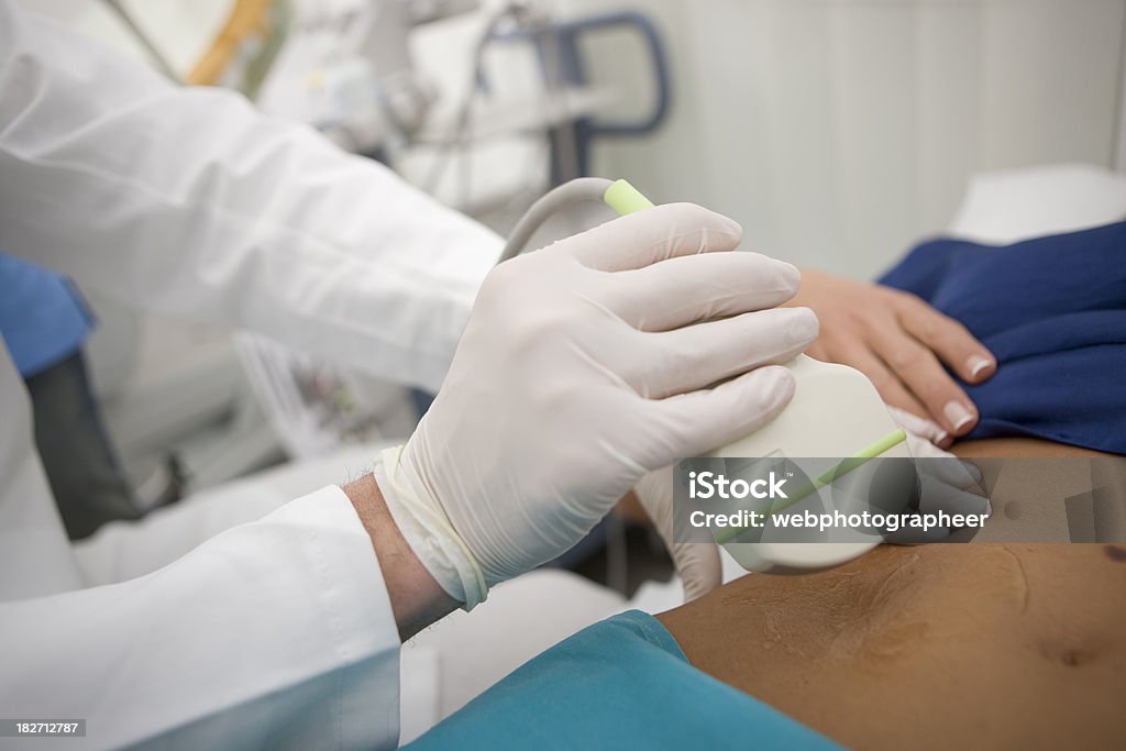 Ultrasound exam "Gynecologist using ultrasound,canon 1Ds mark III" Pregnant Stock Photo