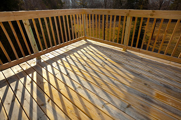 istock New Pine Wood Lumber Patio Deck, Railing With Shadow 182712879