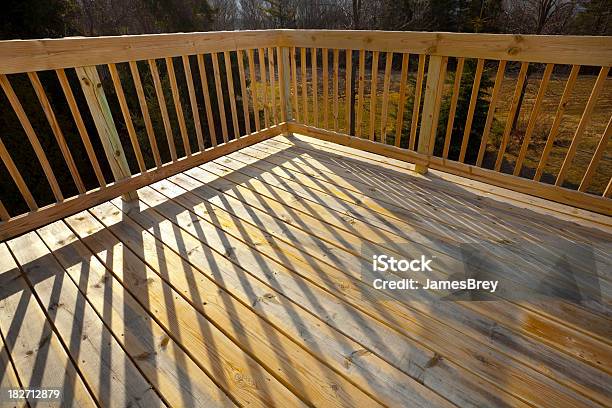 New Pine Wood Lumber Patio Deck Railing With Shadow Stock Photo - Download Image Now