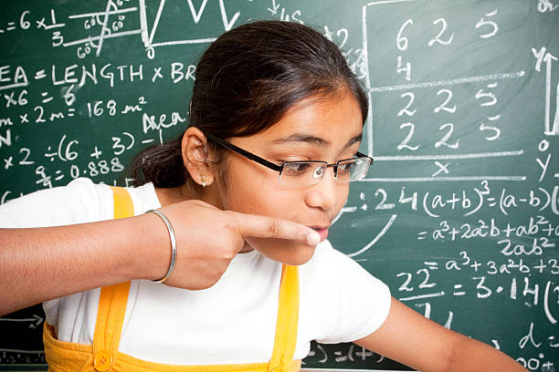 istock Cheerful Indian Girl Student with Mathematics Problems 182712915