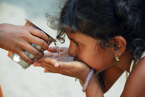 Young girl drinking water