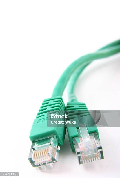 Two Green Network Cables Stock Photo - Download Image Now - Cable, Bandwidth, Lying Down