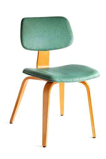 A mid-century modern dining or side chair featuring turquoise blue vinyl cushions with woven texture and blond plywood bent wood structure. The 1950s or 1960s comfortable, beautiful, and stylish design is popular for retro period home decor. Seating furniture shown at three-quarter view, cut out and isolated on white background. 