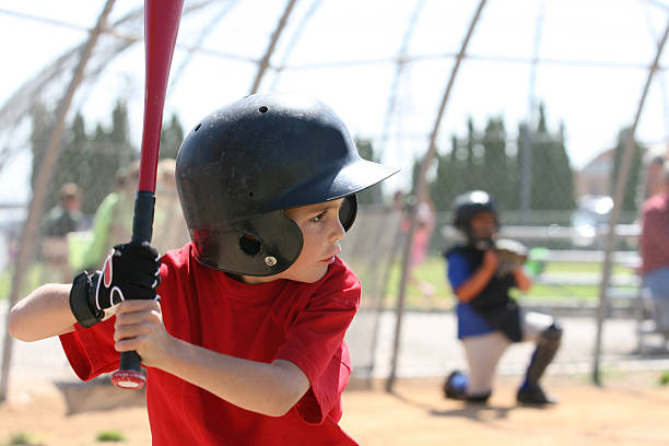 Youth league batter A boy up to bat. youth baseball and softball league photos stock pictures, royalty-free photos & images