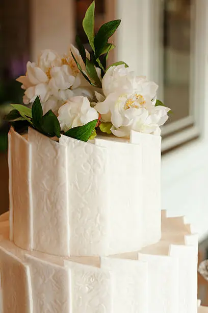 Top of Wedding Cake Decorated with Flowers.