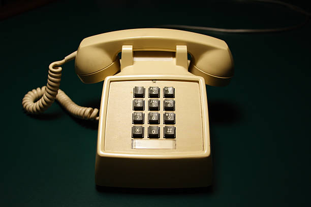 istock 1970's / 1980's Push Button Telephone on Green 182714984