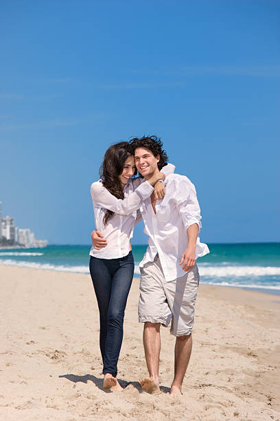 istock Happy couple enjoying the beach 182715110
