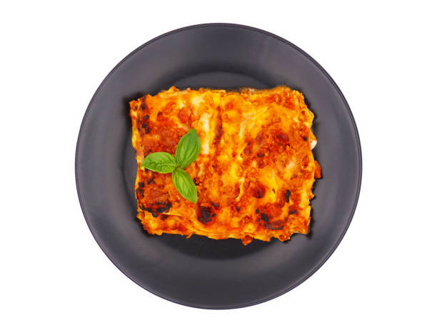 istock Homemade lasagna isolated on white background 1827165078