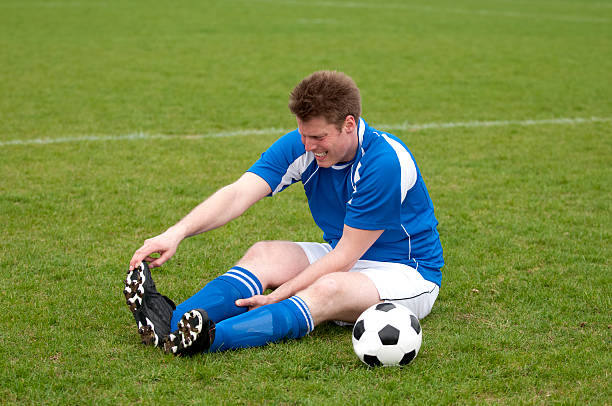 istock Injured soccer player has a problem with foot or ankle 182717422