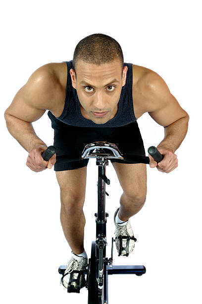 istock Male on exercise bike 182717557