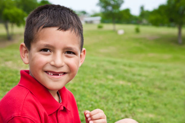 istock Young Boy Smiling in an open field, with copy space 182718450