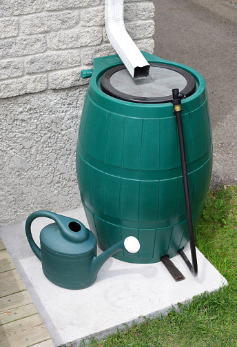 Rain barrel used for water conservation. Related Images: