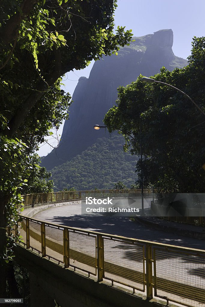 Rio de Janeiro, Road Crossing Forest "Canoas Road crossing Tijuca Forest on the way to the sea. Gavea Rock mountain in the background. Rio de Janeiro, Brazil." Beauty In Nature Stock Photo