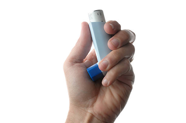 istock Hand holding asthma inhaler 182719205