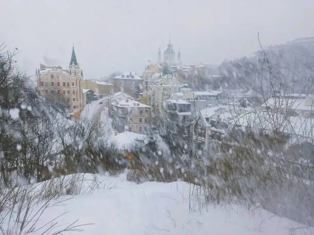 Photo of View of the Kyiv downtown, Andriyivskyi Uzviz street, in snowy winter weather