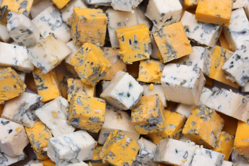 Blue cheese cubes. Close-up.